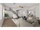 Open-concept living room with a staircase and view into the dining room at 1125 E San Carlos Way, Chandler, AZ 85249