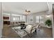 Bright living room with open layout, staircase, and kitchen view at 1125 E San Carlos Way, Chandler, AZ 85249