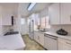 Modern kitchen featuring white cabinets, stainless steel appliances, and quartz countertops at 11333 N 92Nd St # 1118, Scottsdale, AZ 85260