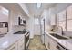 Modern kitchen with white cabinets, quartz countertops, and stainless steel appliances at 11333 N 92Nd St # 1118, Scottsdale, AZ 85260