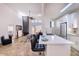 Modern kitchen with white cabinets and stainless steel appliances, open concept to living area at 11333 N 92Nd St # 1118, Scottsdale, AZ 85260