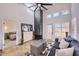 Cozy living room featuring a stone fireplace, neutral palette, and access to the outdoor patio at 11333 N 92Nd St # 1118, Scottsdale, AZ 85260