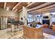 Open-concept living space with kitchen, island seating, and cozy seating area for relaxing and entertaining at 11333 N 92Nd St # 1118, Scottsdale, AZ 85260