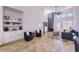 Living area with fireplace, kitchen access, and built-in bar cabinets at 11333 N 92Nd St # 1118, Scottsdale, AZ 85260