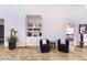 Elegant living room featuring custom built-ins with seating at 11333 N 92Nd St # 1118, Scottsdale, AZ 85260