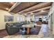 Spacious living room with unique wooden beamed ceiling, stone floors, and comfortable seating area at 11333 N 92Nd St # 1118, Scottsdale, AZ 85260