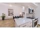 Open concept living area with bar area, access to bedroom and modern kitchen at 11333 N 92Nd St # 1118, Scottsdale, AZ 85260
