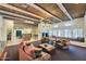 Inviting living room with wood-beamed ceiling, stone floors, and views to other rooms at 11333 N 92Nd St # 1118, Scottsdale, AZ 85260