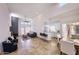 Bright living room featuring a fireplace, modern furnishings, and an open layout to the kitchen at 11333 N 92Nd St # 1118, Scottsdale, AZ 85260