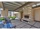 Charming patio with pergola, outdoor fireplace, and seating, perfect for relaxing and entertaining at 11333 N 92Nd St # 1118, Scottsdale, AZ 85260