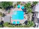 Stunning aerial view of the community pool and lounge area surrounded by lush landscaping and palm trees at 11333 N 92Nd St # 1118, Scottsdale, AZ 85260