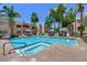 Inviting community pool and spa surrounded by mature palm trees and comfortable lounge seating at 11333 N 92Nd St # 1118, Scottsdale, AZ 85260