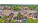 A bird's eye view showing a landscaped backyard, swimming pool, and neatly kept lawn of the property at 1144 E Nunneley Rd, Gilbert, AZ 85296