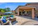 Backyard oasis featuring an outdoor kitchen and a comfortable seating area at 1144 E Nunneley Rd, Gilbert, AZ 85296