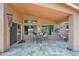 Cozy covered patio features a table and seating perfect for outdoor dining at 1144 E Nunneley Rd, Gilbert, AZ 85296