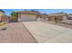 Home featuring a spacious driveway and a convenient two-car garage at 1144 E Nunneley Rd, Gilbert, AZ 85296