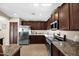 Beautiful kitchen features granite countertops, stainless steel appliances, and ample cabinet space at 1144 E Nunneley Rd, Gilbert, AZ 85296