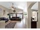 Spacious living room with high ceilings, large windows, and access to the kitchen at 1144 E Nunneley Rd, Gilbert, AZ 85296