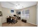 Well-lit home office with a ceiling fan, a window, and plenty of workspace at 1144 E Nunneley Rd, Gilbert, AZ 85296