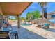 Beautiful backyard featuring a pool, water feature, seating and patio area at 1144 E Nunneley Rd, Gilbert, AZ 85296