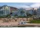 Aerial view showcasing modern residences near a lake, complemented by stunning mountain backdrops, offering a serene environment at 120 E Rio Salado E Pkwy # 102, Tempe, AZ 85281
