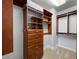 Organized walk-in closet featuring built-in shelving, drawers, and ample storage for clothing and accessories at 120 E Rio Salado E Pkwy # 102, Tempe, AZ 85281