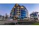 Stunning modern building exterior featuring sleek architecture and ample balconies, beautifully lit at dusk at 120 E Rio Salado E Pkwy # 102, Tempe, AZ 85281