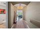 Elegant hallway with stylish lighting fixtures leads to a comfortable living area and a convenient half-bathroom at 120 E Rio Salado E Pkwy # 102, Tempe, AZ 85281