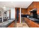 Updated kitchen showcases granite counters, stainless appliances, custom cabinets, and a wine refrigerator at 120 E Rio Salado E Pkwy # 102, Tempe, AZ 85281