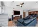 Spacious living room featuring a large TV, ceiling fan, with a view of the kitchen in an open concept layout at 120 E Rio Salado E Pkwy # 102, Tempe, AZ 85281