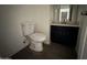 Bathroom featuring a toilet, vanity, and tile floors at 121 N Brown Ave, Casa Grande, AZ 85122