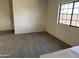 Bedroom featuring a window and tile floors at 121 N Brown Ave, Casa Grande, AZ 85122