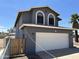 Charming two-story home with a two-car garage and fenced yard at 121 N Brown Ave, Casa Grande, AZ 85122
