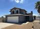 Charming two-story home with a two-car garage and arched windows at 121 N Brown Ave, Casa Grande, AZ 85122