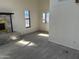 Open living room featuring a fireplace and tile floors at 121 N Brown Ave, Casa Grande, AZ 85122