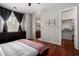 Spacious bedroom features hardwood floors, neutral decor, and connects to an en-suite bathroom at 121 N California St # 35, Chandler, AZ 85225