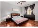 Well-lit bedroom with hardwood floors, modern furnishings, and stylish gray-themed decor at 121 N California St # 35, Chandler, AZ 85225