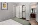 Bright bedroom showcases a closet and a view of the ensuite bathroom at 121 N California St # 35, Chandler, AZ 85225