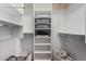 Organized walk-in closet features built-in shelving and ample storage space at 121 N California St # 35, Chandler, AZ 85225