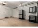 Spacious garage featuring epoxy flooring, storage cabinets, and plenty of room for vehicles at 121 N California St # 35, Chandler, AZ 85225