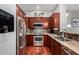 Well-appointed kitchen featuring stainless steel appliances, dark wood cabinetry, and stylish countertops at 121 N California St # 35, Chandler, AZ 85225