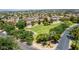 An aerial view of the lush green neighborhood park, lined by mature trees in a well maintained community at 1282 N Banning St, Gilbert, AZ 85234