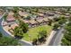 Aerial view of homes featuring well-manicured lawns, mature trees, and community green spaces at 1282 N Banning St, Gilbert, AZ 85234