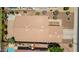 Aerial view of a home featuring a brown shingle roof, small pool, and desert landscaping at 1282 N Banning St, Gilbert, AZ 85234