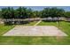 Aerial view of a community basketball court in a park-like setting surrounded by mature trees and green grass at 1282 N Banning St, Gilbert, AZ 85234
