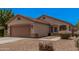 Well-maintained single-story home with desert landscaping and a spacious two-car garage at 1282 N Banning St, Gilbert, AZ 85234