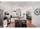 Bright eat in kitchen featuring stainless steel appliances, white cabinets, and an island at 1282 N Banning St, Gilbert, AZ 85234