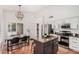 Eat in kitchen with modern appliances, center island, and adjacent dining area at 1282 N Banning St, Gilbert, AZ 85234