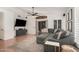 Bright living room with a cozy sectional, modern decor, and hardwood floors at 1282 N Banning St, Gilbert, AZ 85234