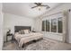 Serene main bedroom featuring soft lighting, a vaulted ceiling, and plantation shutters at 1282 N Banning St, Gilbert, AZ 85234